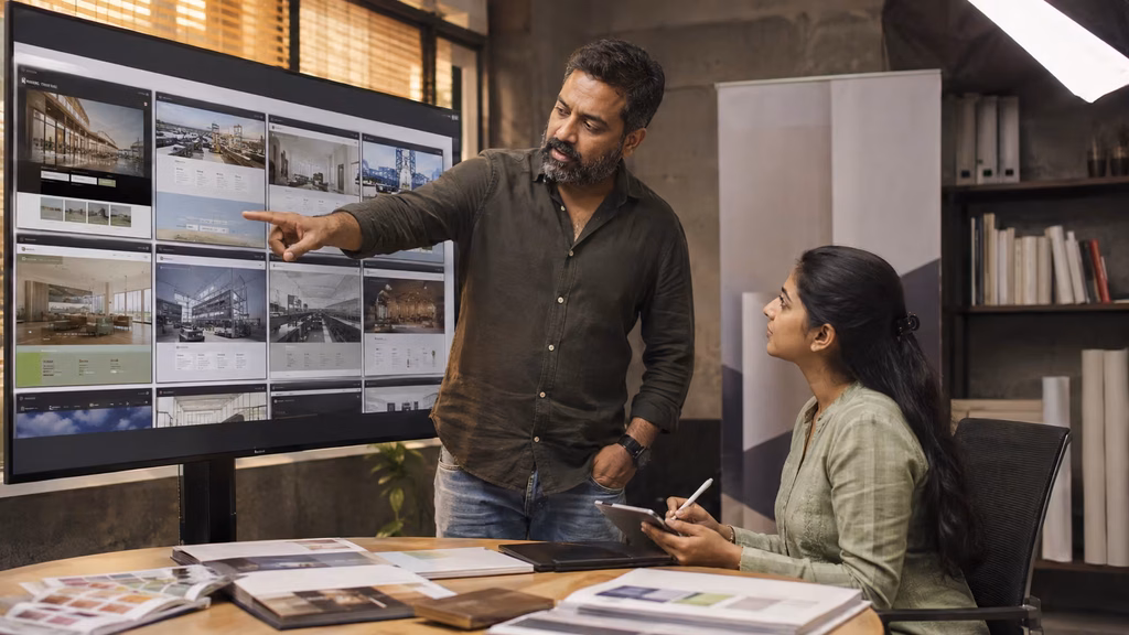 Creative director showing live website portfolio to a web design agency Chennai client